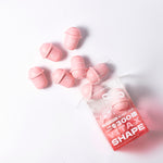 VitaxShape™小罐菌益生菌盒裝傾倒，粉紅小罐散落於白底